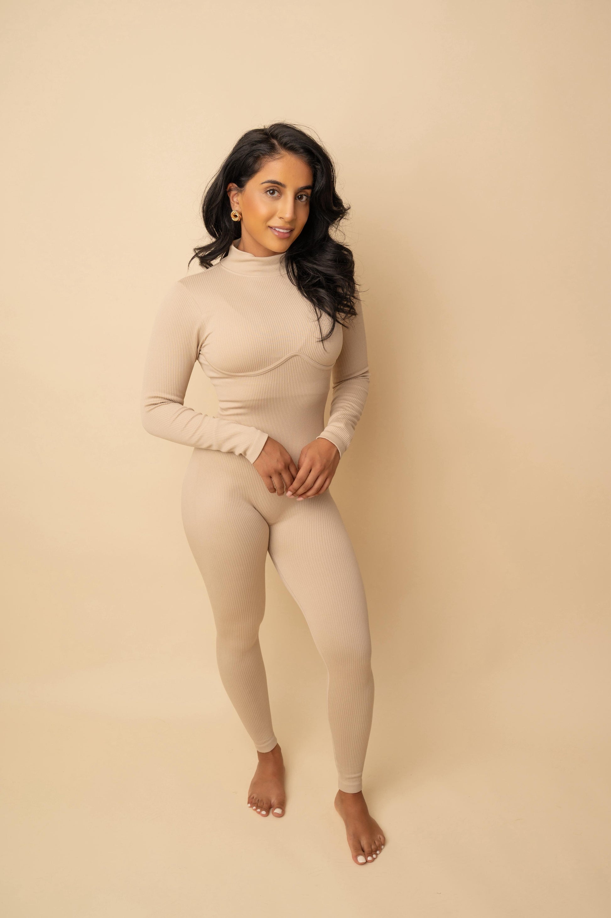 Sculpted Luxe Ribbed Jumpsuit
Available in Taupe & Beige
